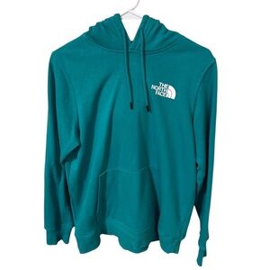 The North Face teal Never Stop Exploring hoodie, pink design and logo on back